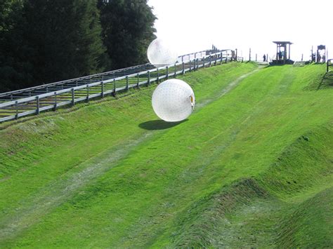 Zorbing pigeon forge - Outdoor Gravity Park Zorbing Admission Ticket in Pigeon Forge The OGO (Outdoor Gravity Orb) is an 11 foot transparent sphere constructed from over 300 square feet of a special plastic, more than 1,000 little, special, plastic, anchors, about 600 multi-colored strings and endless hours of welding, gluing and tying (part science and part art ... 